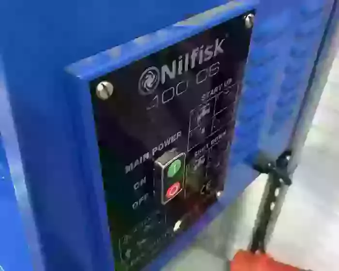 Control panel on a Nilfisk DTE wall-mounted static pressure washer before contactor and overload replacement repair.